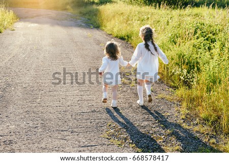 Similar – Foto Bild Zwei Schwestern spielen am Strand