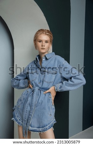 Similar – Image, Stock Photo Blonde woman wearing denim shirt and black leather skirt sitting in an urban bench.