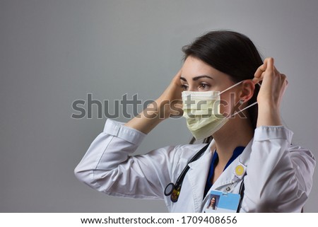 Similar – Image, Stock Photo Woman holds protective mask in hands at city street