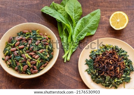 Two famous Mediterranean dish with chicory leaves. Lebanon Hindbeh Bi Zeit (chicory with olive oil) and Italian Cicoria e Fagioli (Chicory and beans). Borlotti beans aka cranberry beans aka rosecoco. Сток-фото © 