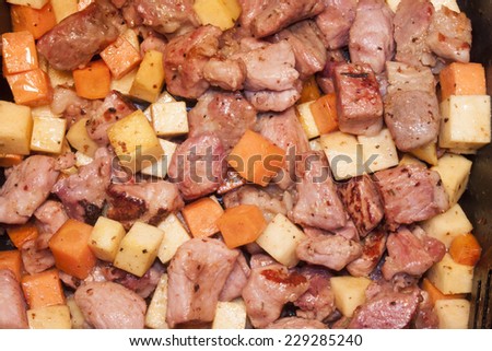 Meat, carrot and swede dice, on a stone plate