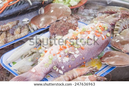 Restaurant fish dish at a market, near a restaurant
