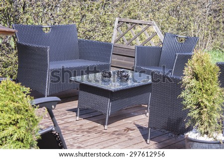 Deck furniture on terrace, on a shiny day