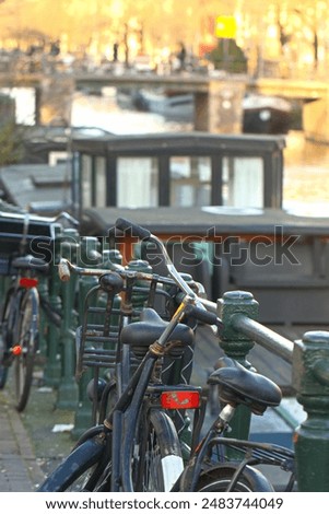 Similar – Image, Stock Photo Bridge over the Amstel river at night in Amsterdam