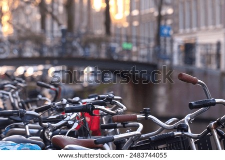 Similar – Image, Stock Photo Bridge over the Amstel river at night in Amsterdam