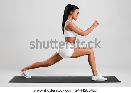 Similar – Image, Stock Photo Legs of a woman in a white culotte with colorful geometric shapes on a cobbled pavement. Casting shadows. Walking, pedestrian