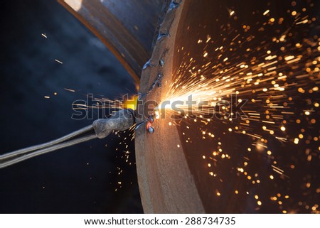 Metal cutting with a gas burner and many sparks