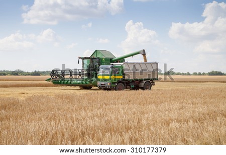 Gorna Oryahovitsa - June 20: Harvesting of grain harvest. Plow truck full of grain against the blue sky with white clouds on June 20, 2015 Gorna Oryahovitsa, Bulgaria
