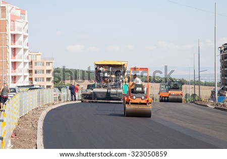 Burgas - August 18: Road construction site - asphalt paving of a high-speed section in suburban conditions with road construction machinery on August 18, 2015, Burgas, Bulgaria