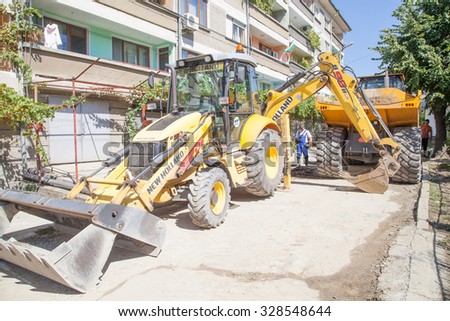 Gorna Oryahovitsa - September 14: Repair of street water installation with heavy machinery and hand-urban arm of the September 14, 2015, Gorna Oryahovitsa, Bulgaria