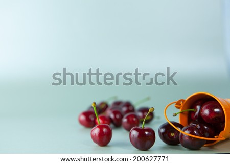 Sweet ripe cherry.Cherries scattered on a flat surface. Beautiful sweet berry. Cherries, fruit, food, vitamins - the concept of healthy eating, enjoyment of food. Article about fruit.