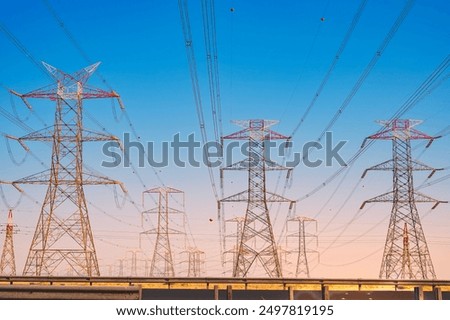 Similar – Image, Stock Photo Overhead Power Pole with High Voltage Lines against a Blue Sky with Sheep Clouds / Power Pole / Energy