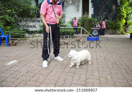 BANGKOK -  AUGUST 2 2014, Dusit Sound Dog Show  in Dusit Zoo  or Kaow-din Zoo ,More Dog have a special talent show for free,for  people who come to visit Dusit Zoo. AUGUST 2 2014 - BANGKOK THAILAND