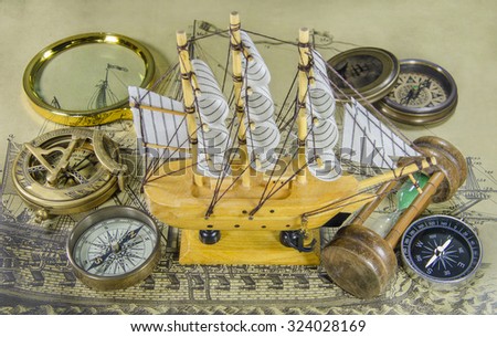 Mini model ship with compass and hourglass
