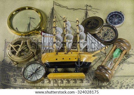 Mini model ship with compass and hourglass