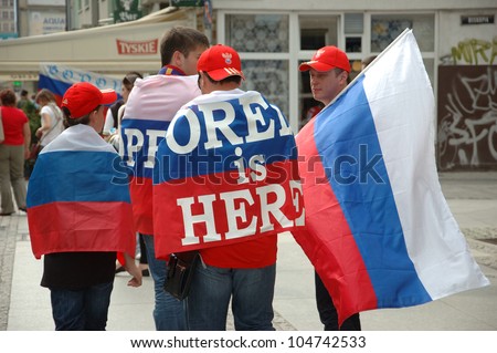 WROCLAW, POLAND - JUNE 8: Unidentified Russians with flag go to Euro 2012 fanzone on June 8, 2012 in Wroclaw. The EURO 2012 will be held from June 8 - July 1, 2012 hosted by Poland and Ukraine.