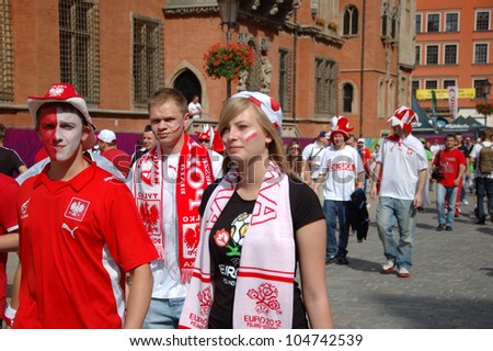 WROCLAW, POLAND - JUNE 8: Unidentified Polish fans enters fanzone to see the first game on June 8, 2012 in Wroclaw. The EURO 2012 will be held from June 8 - July 1, 2012 hosted by Poland and Ukraine.