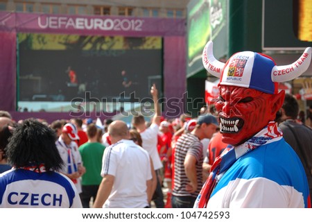 WROCLAW, POLAND - JUNE 8: Unidentified Czech fan with mask visits Euro 2012 fanzone on June 8, 2012 in Wroclaw. The EURO 2012 will be held from June 8 - July 1, 2012 hosted by Poland and Ukraine.
