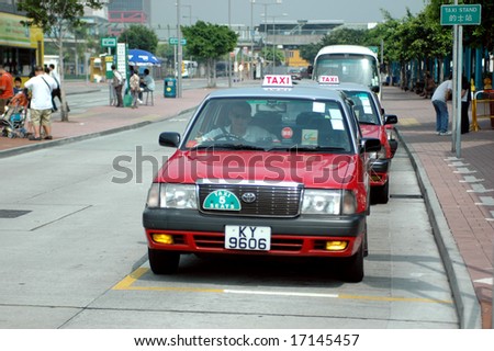 HONG KONG, CENTRAL - MAY 17, 2007: taxis waiting in queue at ferry pier.