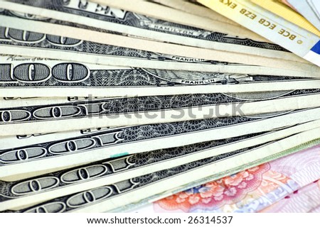 USD, Euro and RMB setup in fan shape. Photo of different banknotes, money in different shapes and colors. Useful for financial, economic backgrounds.