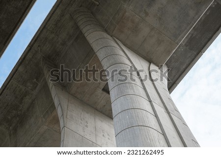 Image, Stock Photo Bridge with concrete piers in the evening sunlight and elegant shadow cast