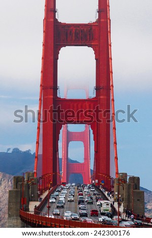 Close-up of Golden Gate Bridge with cars traffic on it. San Francisco, California, USA