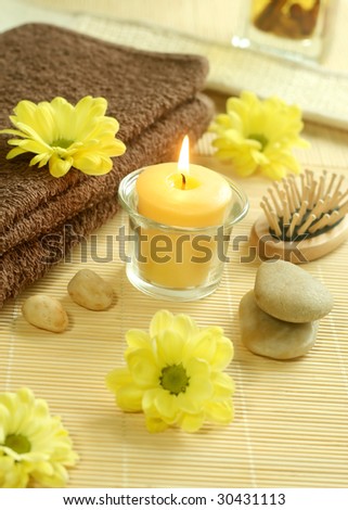 Spa background. towel, flowers, stones and candle