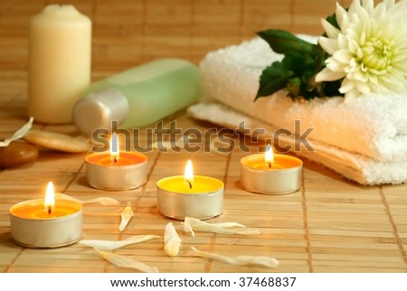 towel, candles and flowers