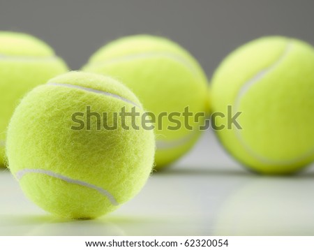 tennis balls on white surface ,f or tennis,recreation and sport themes