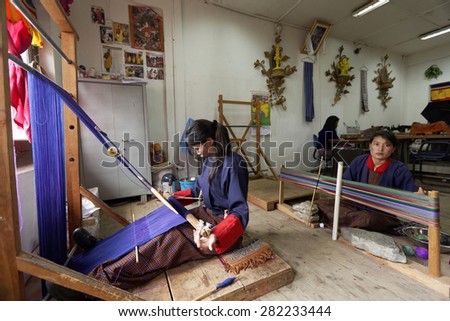 Students learning traditional wool weaving process at school of arts and crafts, Thimpu, BHUTAN, Circa MAY 2015