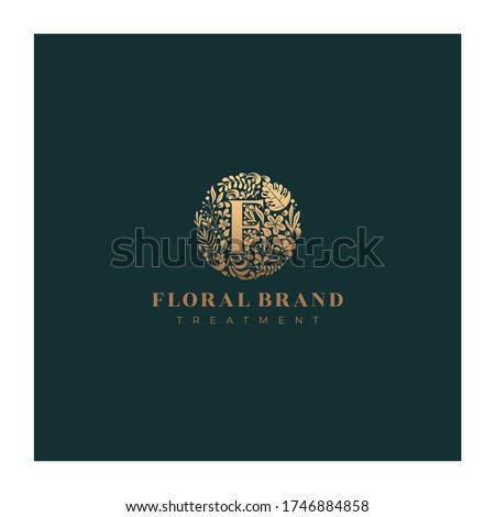 Letter F golden luxurious circle floral decorative logo
