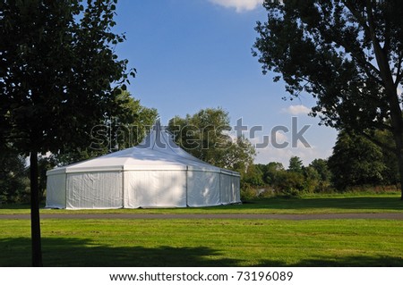 White tent White circus or party tent in a public park