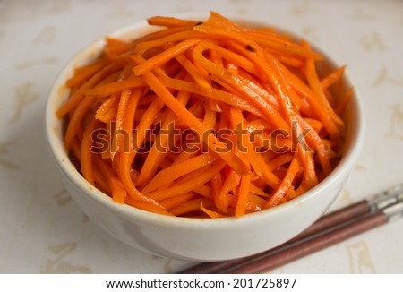 Korean carrot salad in a white plate