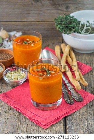 Pumpkin pureed soup in cups. Shallow depth of field