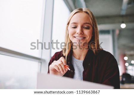 Similar – Image, Stock Photo Blond woman writing on clipboard bending on office desk