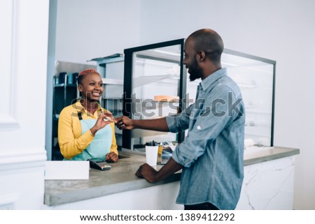 Similar – Foto Bild Ethnische Barista-Frau mit Kaffee in der Bar