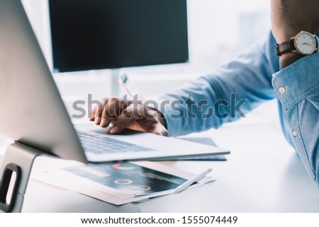 Similar – Image, Stock Photo Faceless employee using pressing machine in printing office