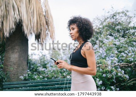 Similar – Image, Stock Photo Young focused ethnic sportswoman on street before training