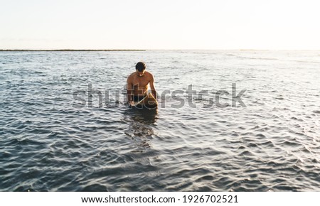 Similar – Image, Stock Photo Unrecognizable athlete practicing surfing on ocean wave