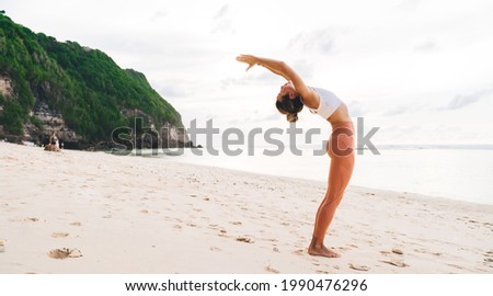 Similar – Foto Bild Nicht erkennbare Sportlerin, die im Freien die Arme streckt.