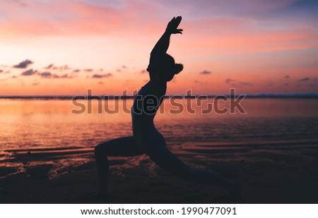 Similar – Image, Stock Photo Anonymous sportswoman practicing yoga on street