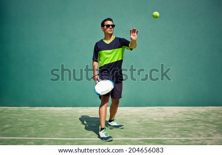 Athletic paddle gamer ready with racket in the hand ready to touch the ball, healthy lifestyle concept