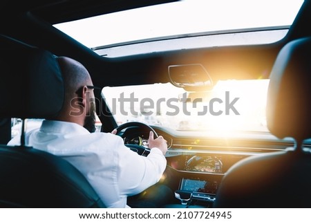 Similar – Image, Stock Photo Unrecognizable man driving car in Ireland