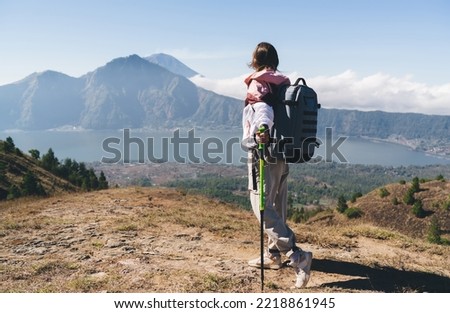 Similar – Image, Stock Photo Unrecognizable hiker observing wild valley from rocky cliff
