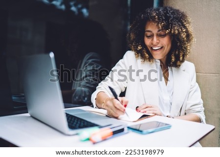 Similar – Image, Stock Photo Ethnic woman taking notes in notebook at home