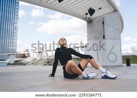 Similar – Image, Stock Photo Thoughtful young female athlete listening to music in studio