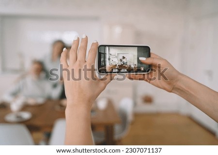 Similar – Image, Stock Photo Unrecognizable photographer taking photo on camera near wall outdoors