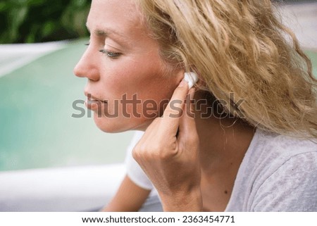 Similar – Image, Stock Photo Pensive woman traveler sitting near calm lake