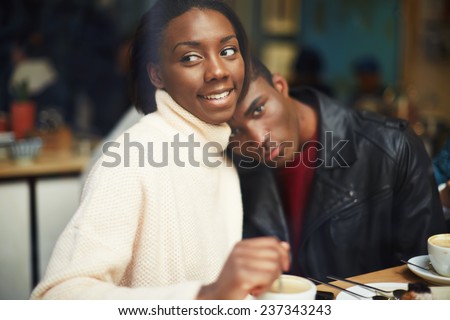 Portrait of young couple in love at a coffee shop, two people in cafe enjoying the time spending with each other, young couple at san valentines day, friends having coffee and enjoying themselves