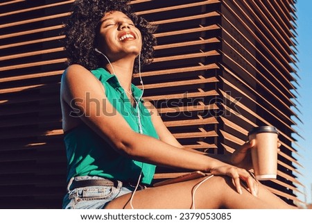 Similar – Image, Stock Photo Positive black female meloman speaking on smartphone in library